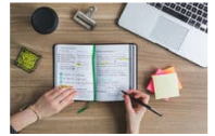 image of books, notes, and student studying.
